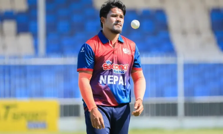 Karan KC bowling for Nepal after taking a first-ball wicket against the Netherlands.